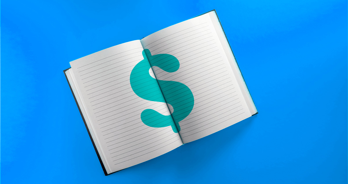 Caderno com desenho de cifrão no meio